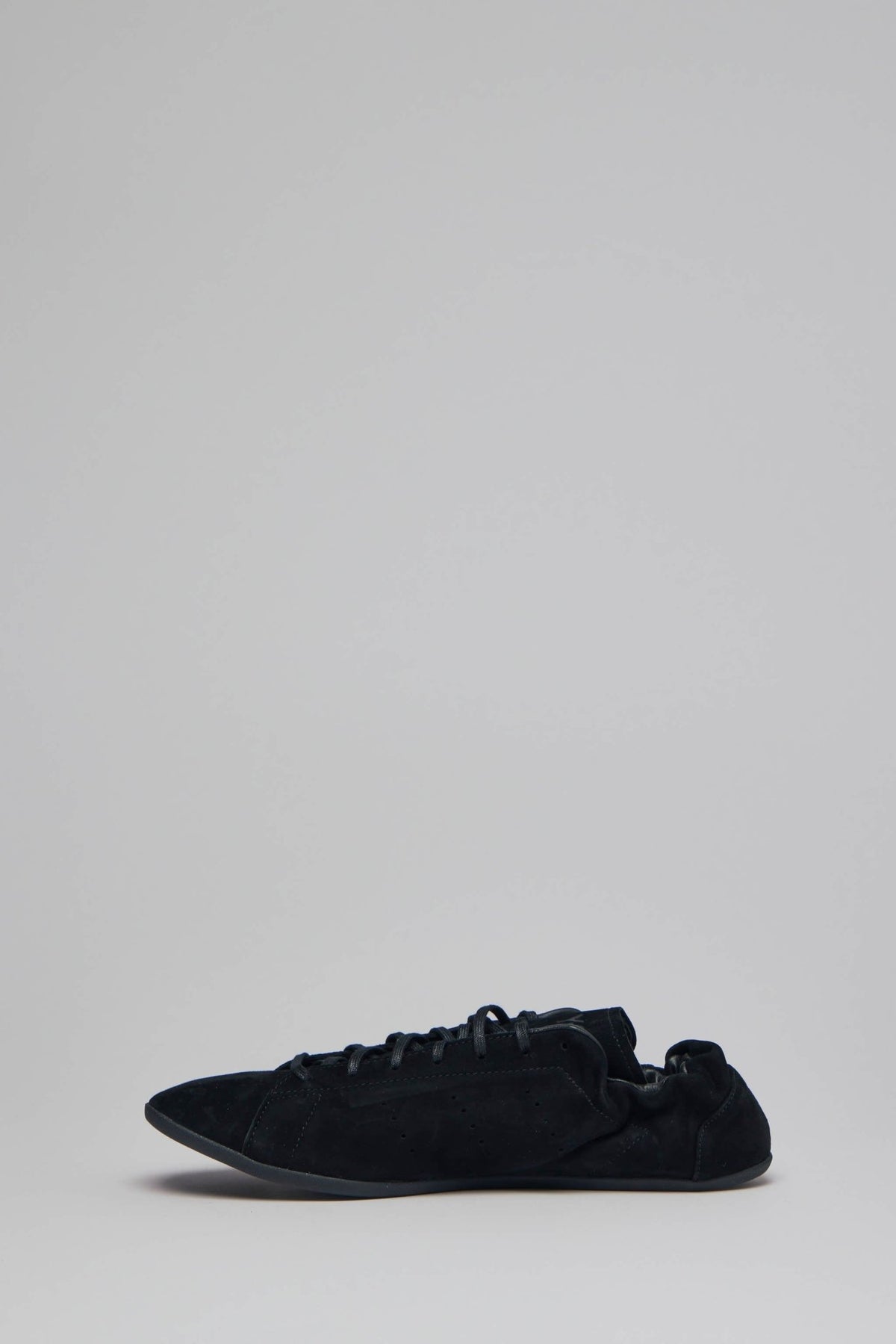 Detail shot of Y-3 Yohji Yamamoto sneaker lace-up closure and rounded toe design