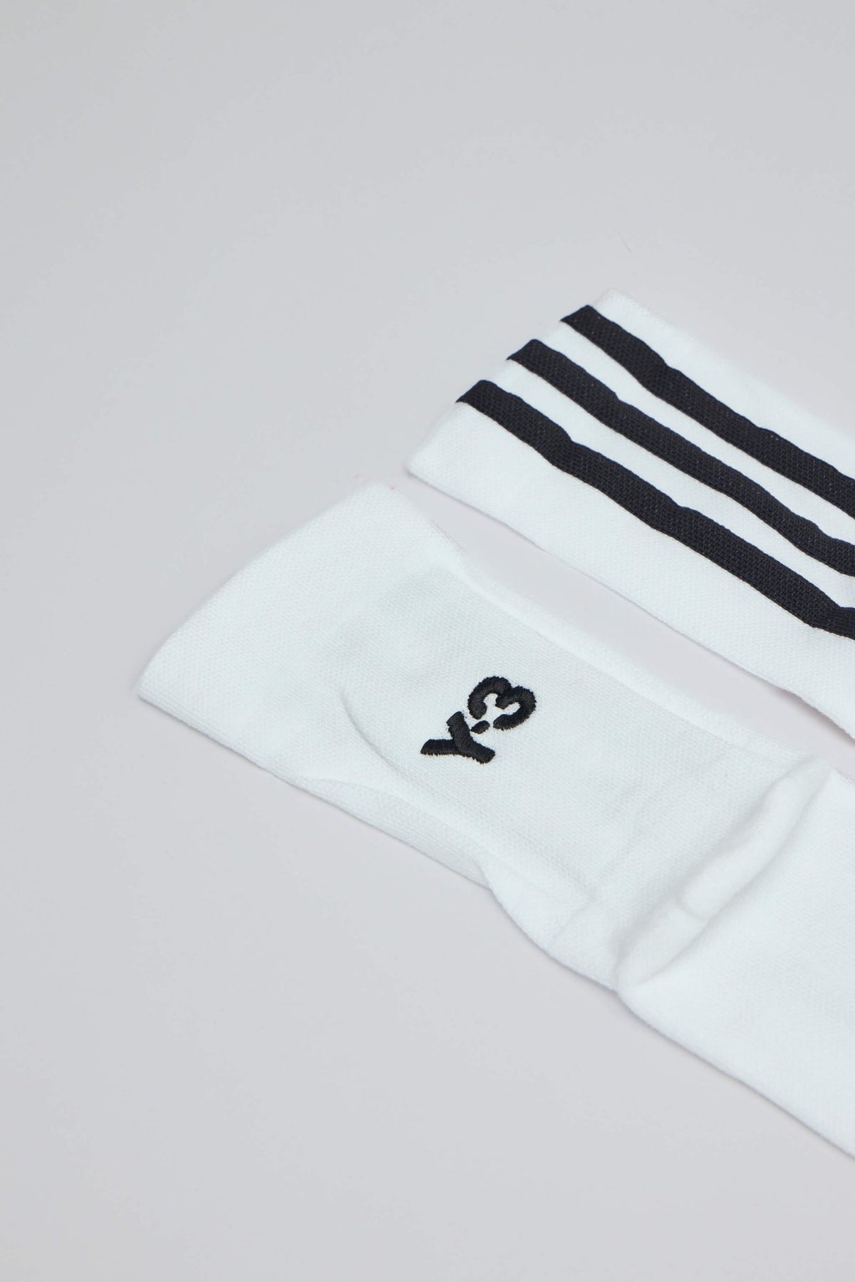 Y-3 Yohji Yamamoto stripe sock styled with low-top sneakers
