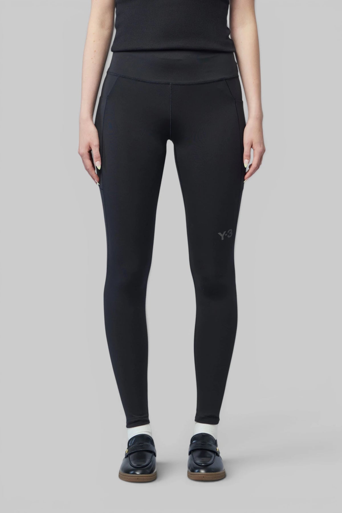 Close-up of Y-3 logo on the thigh of the leggings