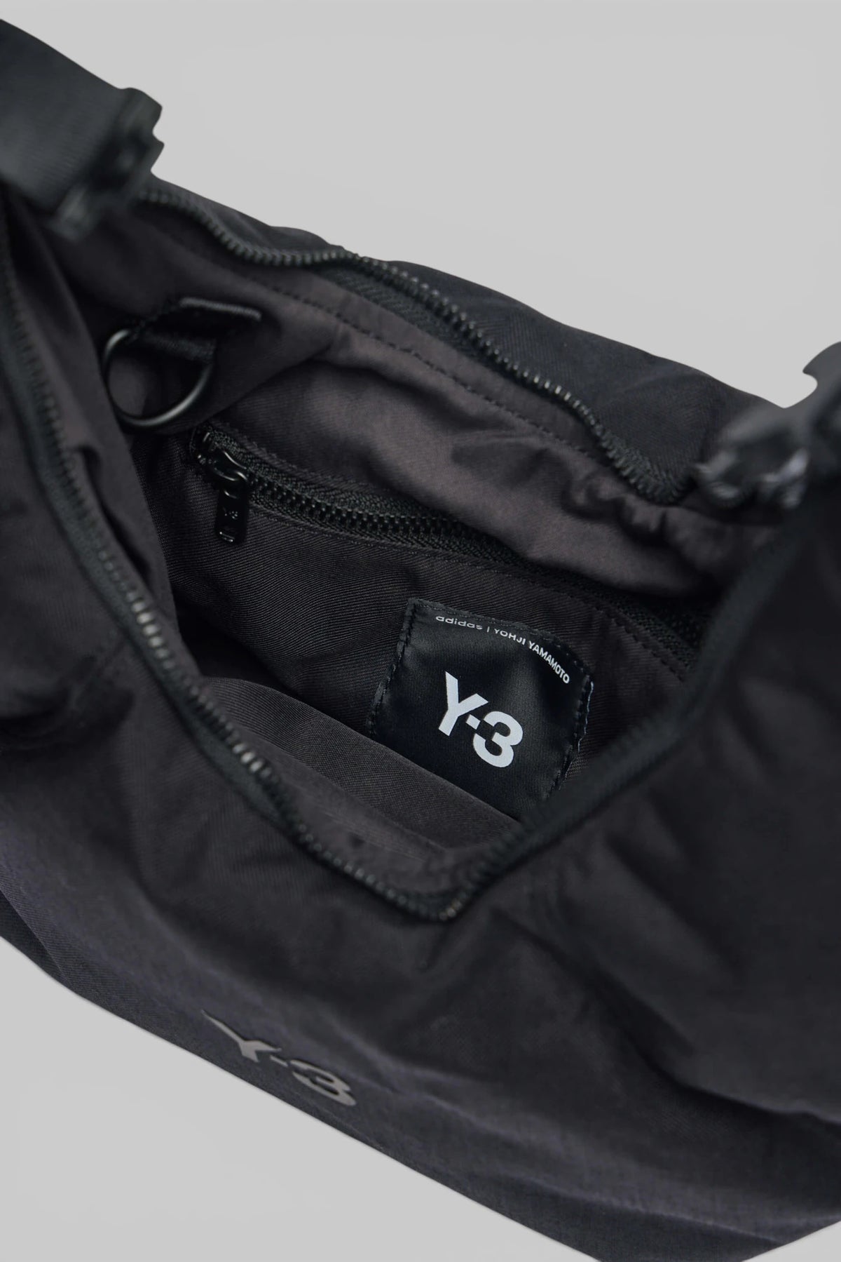 Y-3 Crescen Bag side profile showing compact silhouette