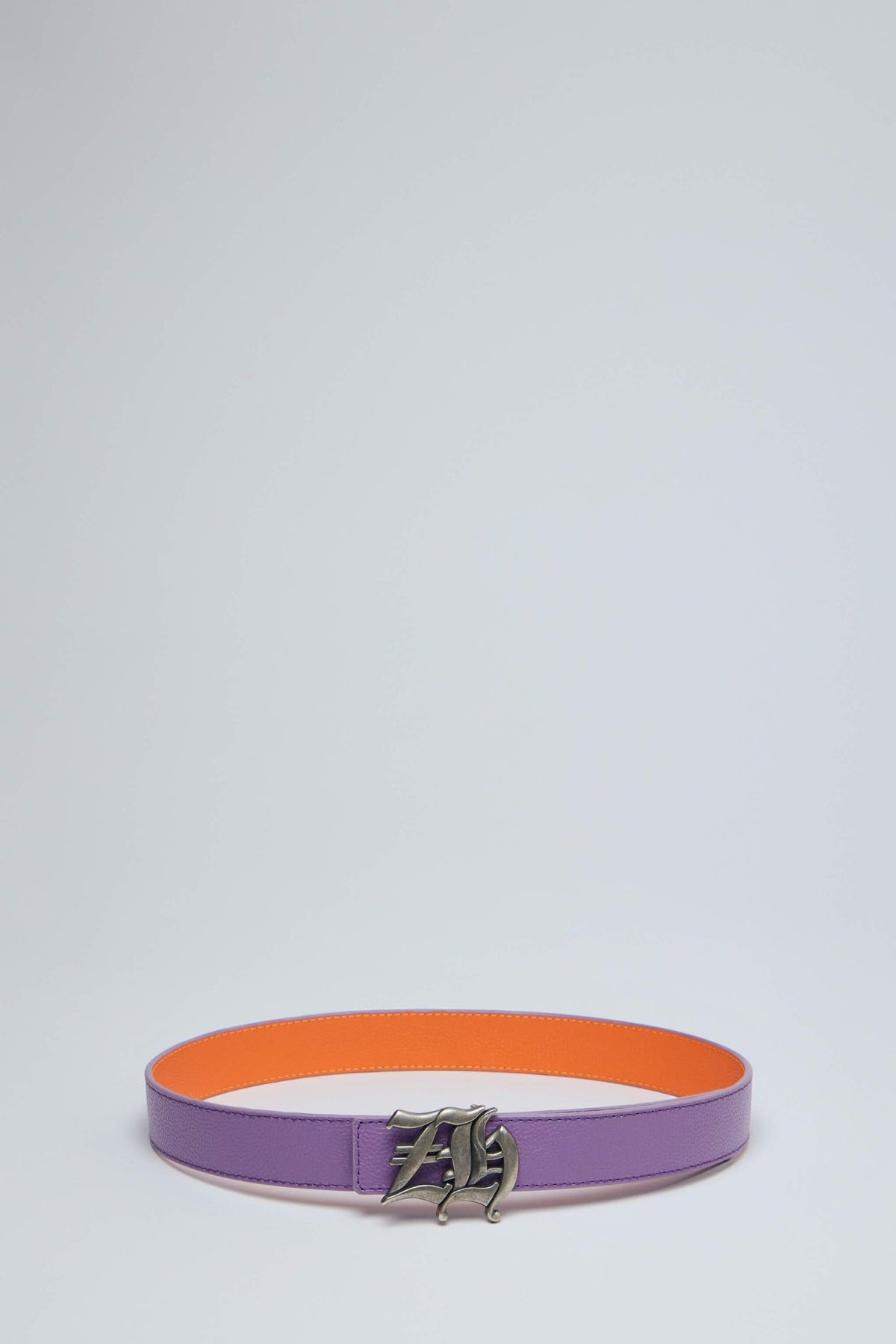 Reversible belt displayed showing both orange and purple color options