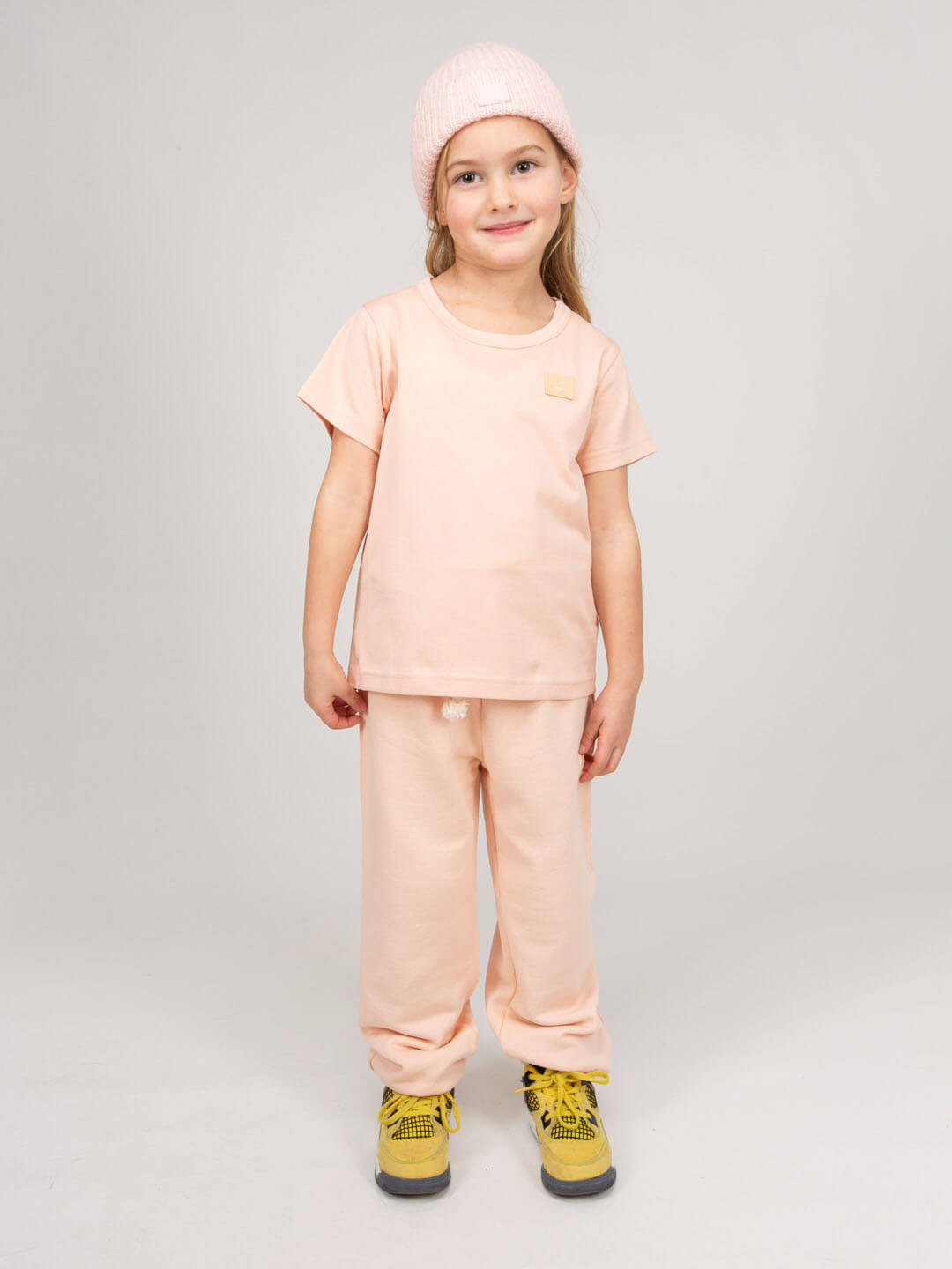 Full outfit styling with Acne Studios kids track pants