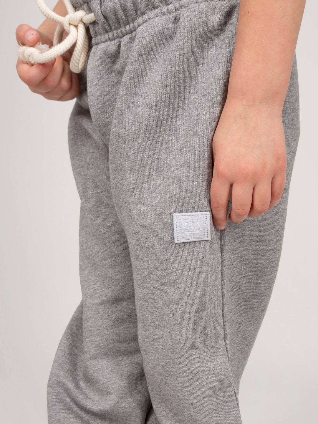 Kids wearing Acne Studios mini sweatpants with drawstring waist
