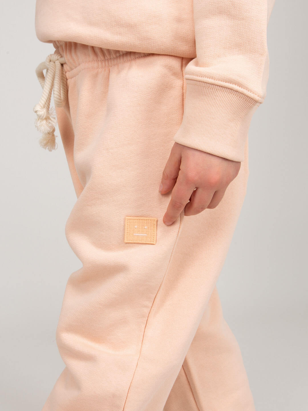 Back view of Acne Studios Nash Face mini sweatpants
