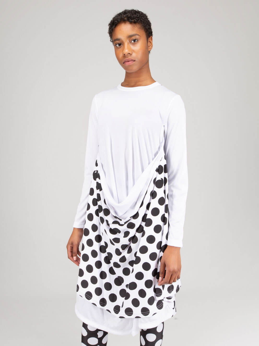 Close-up detail of soft polyester fabric texture on longsleeve midi dress