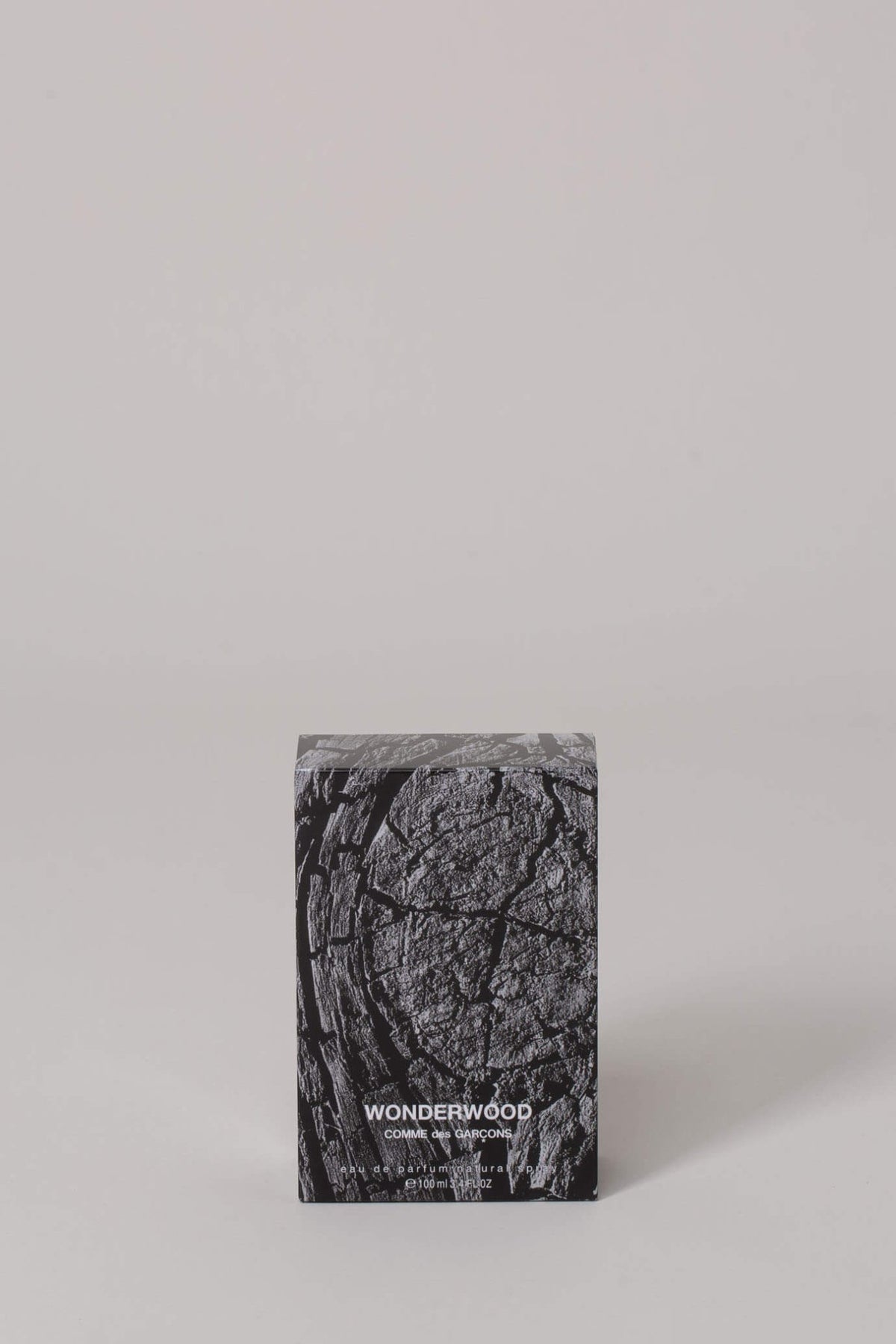 Close-up of Comme des Garçons Parfums Wonderwood packaging and box