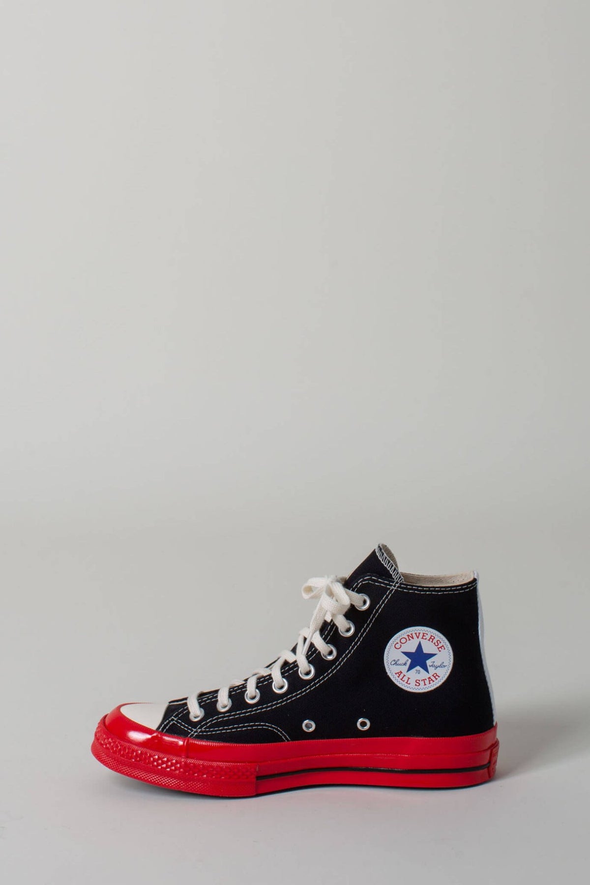 Red sole detail on Comme des Garçons PLAY CONVERSE sneakers