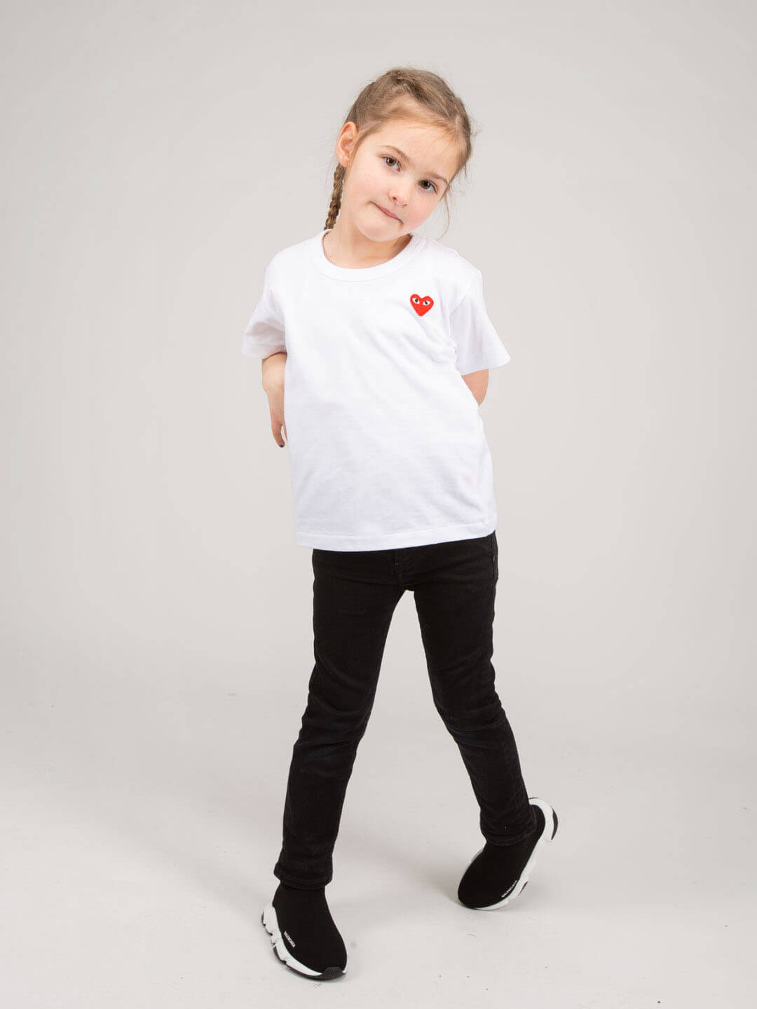 Kids wearing Comme des Garçons PLAY cotton t-shirt casual styling