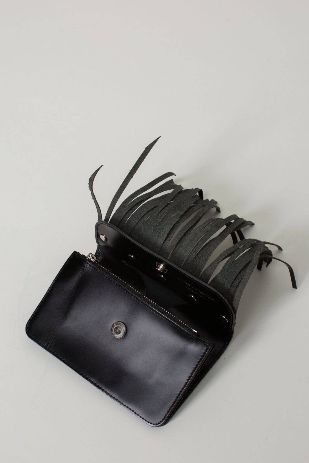 Comme des Garçons black small wallet showing compact proportions