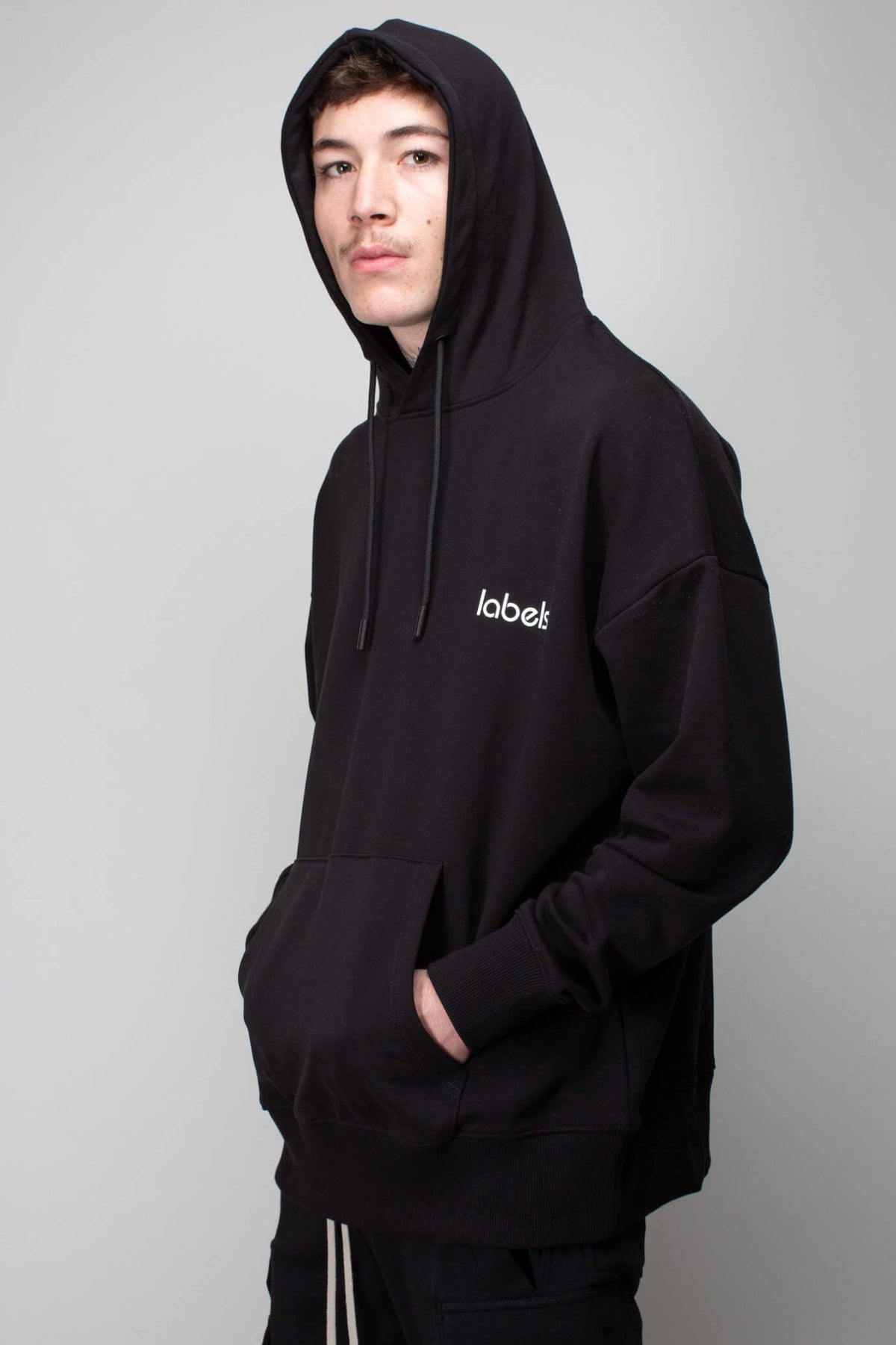 Back view showing LABELS logo print on cotton hoodie
