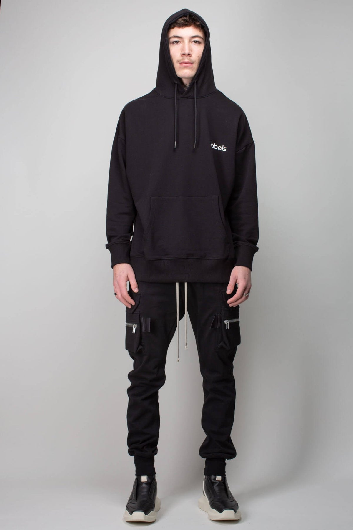 Model wearing LABELS Labels Hoodie 2023 streetwear style