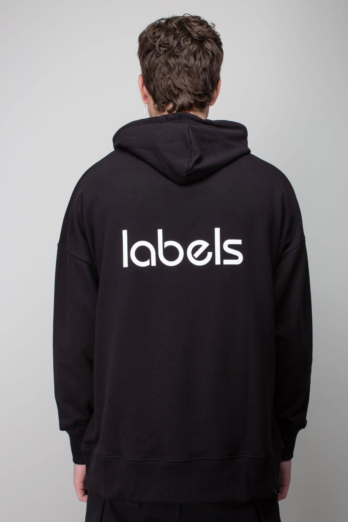 Close-up of LABELS hoodie kangaroo pocket and drawstring hood
