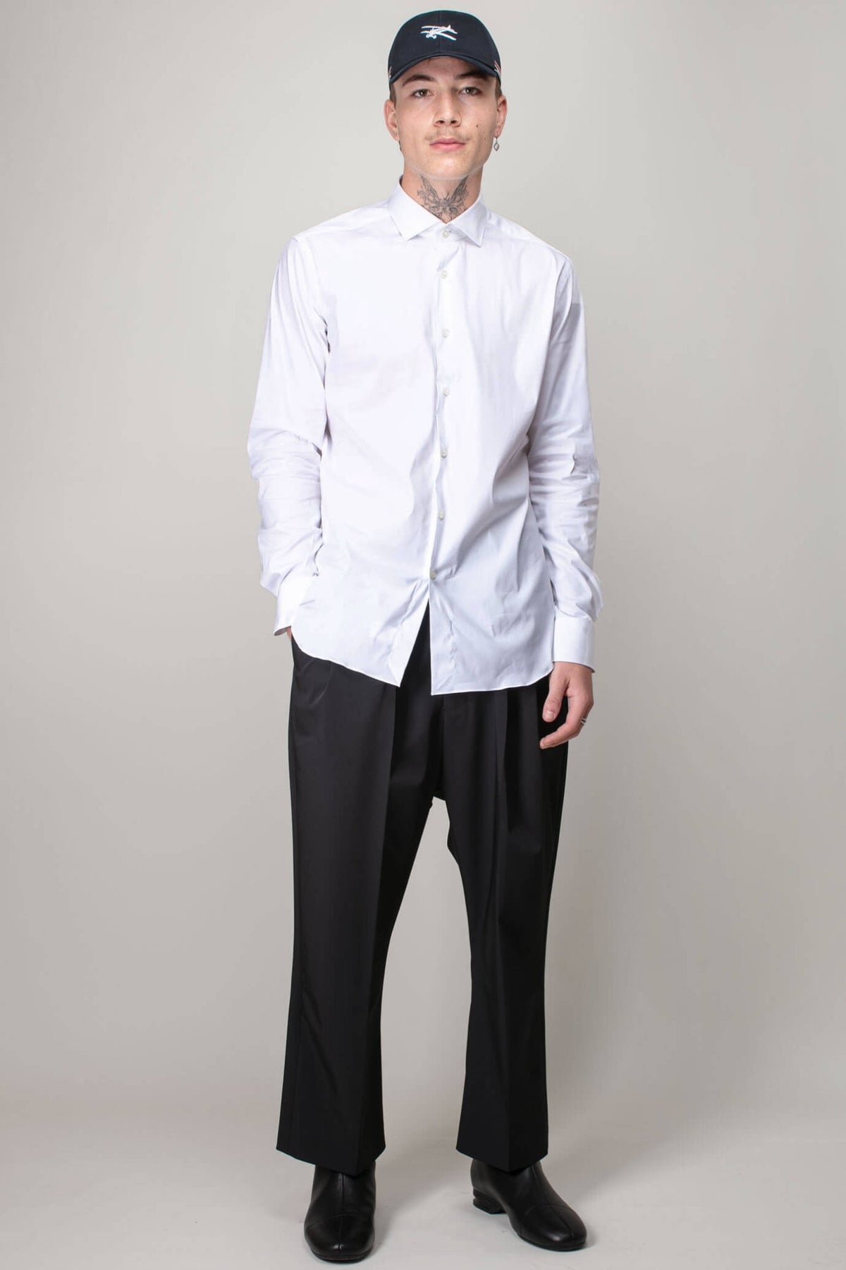 Close-up view of classic shirt collar and button details by Xacus